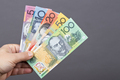 Australian money in the hand on a gray background - PhotoDune Item for Sale
