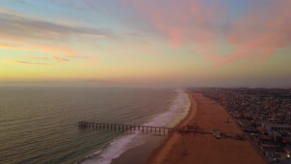 Aerial drone view of a sunset at the beach over the ocean