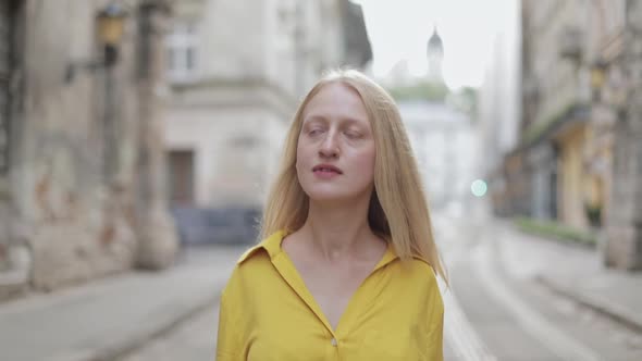 Crop View of Young Beautiful Woman Looking Around While Walking at Street. Portrait of Female Person