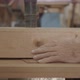 Old man hands pushing thin wood into a filer - VideoHive Item for Sale