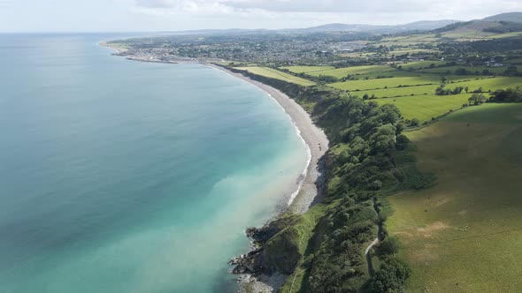 Stunning Landscape Of Green Coastal Mountains With A View Of Greystones South Beach And Town In Wick