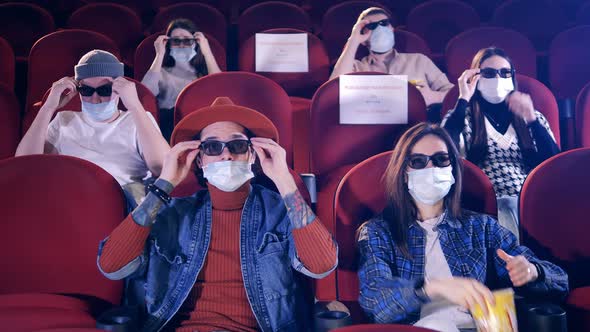 Viewers Wearing Face Masks Put on 3D Glasses