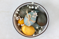 Easter eggs in a bowl with spring flowers - PhotoDune Item for Sale