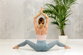 Slim woman doing yoga in modern studio - PhotoDune Item for Sale