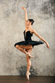 Graceful young ballerina dancing in studio - PhotoDune Item for Sale