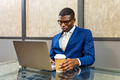 Black young businessman working on laptop - PhotoDune Item for Sale