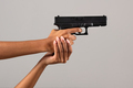 Female black hands with gun - PhotoDune Item for Sale