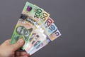 Australian money in the hand on a gray background - PhotoDune Item for Sale