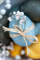 Pastel blue easter egg with spring flowers, closeup - PhotoDune Item for Sale