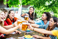 Young friends drinking and toasting beer at brewery bar restaurant - PhotoDune Item for Sale