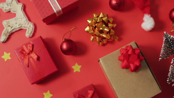 Christmas decorations with presents and copy space on red background