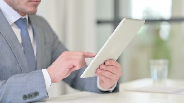 Close Up of Businessman Using Digital Tablet