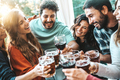 Happy group of friends cheering wine and beer glasses at cocktail bar restaurant  - PhotoDune Item for Sale
