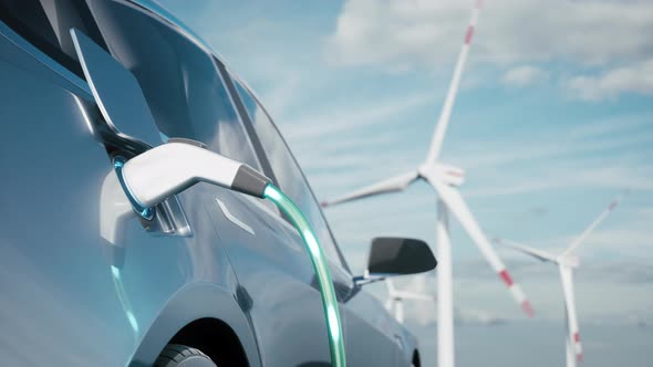Electric Car Charging On Wind Turbines Background