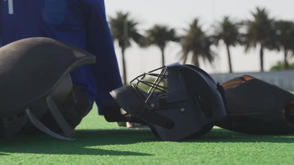 Female hockey players with helmet on a field