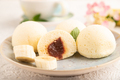 Japanese rice sweet buns mochi filled with jam on a gray concrete. side view, selective focus. - PhotoDune Item for Sale