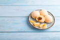 Japanese rice sweet buns mochi filled with tangerine jam on a blue wooden. side view, copy space. - PhotoDune Item for Sale