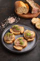 Bread sandwiches with jerky salted meat, sorrel and cilantro microgreen on black. side view. - PhotoDune Item for Sale