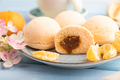 Japanese rice sweet buns mochi filled with tangerine jam and cup of coffee on a blue wooden - PhotoDune Item for Sale