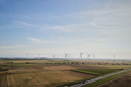Windmill turbines in countryside. Sustainable wind energy concept - PhotoDune Item for Sale