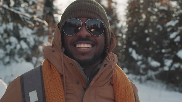 Black Man Among Snowy Trees