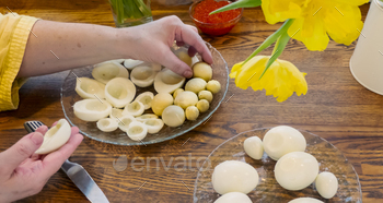 eggs. womens hands cut eggs in half and take out the yolk to make eggs stuffed with caviar. High quality photo