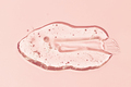 Liquid gel smear isolated on pink background - PhotoDune Item for Sale