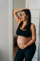 Happy pregnant woman stands at home. - PhotoDune Item for Sale