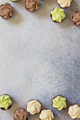 Chocolate with vanilla, chocolate and pistachio cream on marble background. - PhotoDune Item for Sale