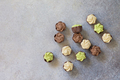 Chocolate with vanilla, chocolate and pistachio cream on marble background.  - PhotoDune Item for Sale