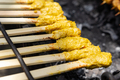 Close-up of Balinese chicken satay (sate lilit) on the grill - PhotoDune Item for Sale