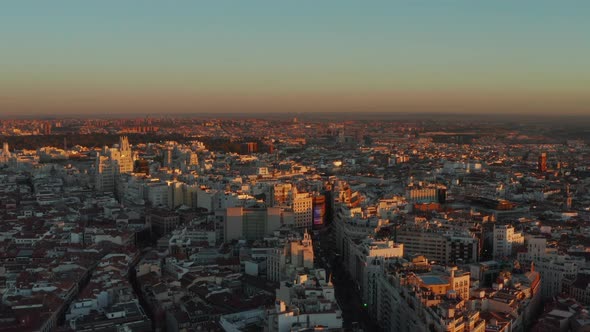 Tops of Buildings in City Centre Lit By Setting Sun