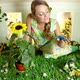 Young woman with garden in small room - VideoHive Item for Sale