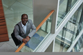 Mature African American businessman in grey suit looking at camera - PhotoDune Item for Sale