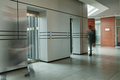 Part of corridor with blurred silhouettes of two businessmen - PhotoDune Item for Sale