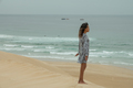 Woman seen meditating on sand dune - PhotoDune Item for Sale