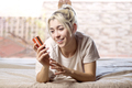 young woman relaxing on bed at home, holding credit card, shopping. - PhotoDune Item for Sale