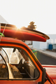 A stack of surfboards on a retro car roof with sun shining. Summer and surf background wallpaper. - PhotoDune Item for Sale