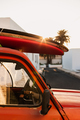 stack of surfboards on a retro car roof with sun shining. Summer and surf background wallpaper. - PhotoDune Item for Sale