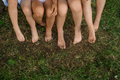 Children's bare feet close-up on the lawn in the park - PhotoDune Item for Sale