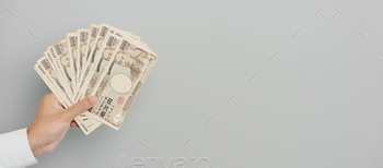 sand Yen money. Japan cash, Tax, Recession Economy, Inflation, Investment, finance and shopping payment concepts