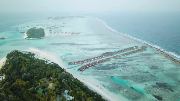 Aerial Drone View of a Beautiful Atoll or Island with a Resort in the Maldives