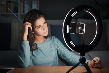 ing a smartphone and a ring light