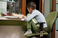 Kid boy studying at home and doing school homework, distance learning education , sitting at table. - PhotoDune Item for Sale