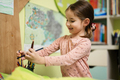 Cute little girl drawing in her room. - PhotoDune Item for Sale
