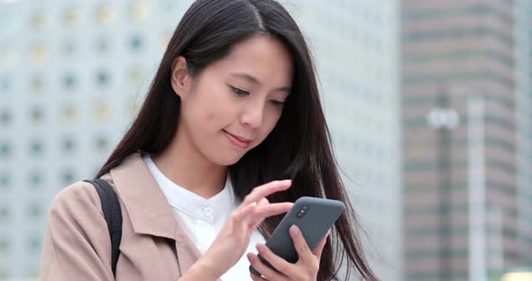 Woman look at smart phone at outdoor