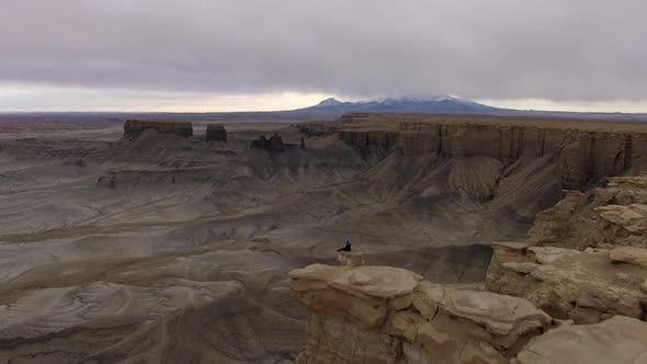 Flying over cliffs at Moonscape overlook in the Utah desert