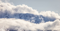 Tantalus Range covered in Snow and Clouds during Winter Season. - PhotoDune Item for Sale