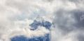Mountains covered in Snow and Clouds during Winter Season. - PhotoDune Item for Sale
