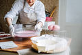 Online classes and workshops on cake decorating and baking. Female Confectioner baker make custom - PhotoDune Item for Sale